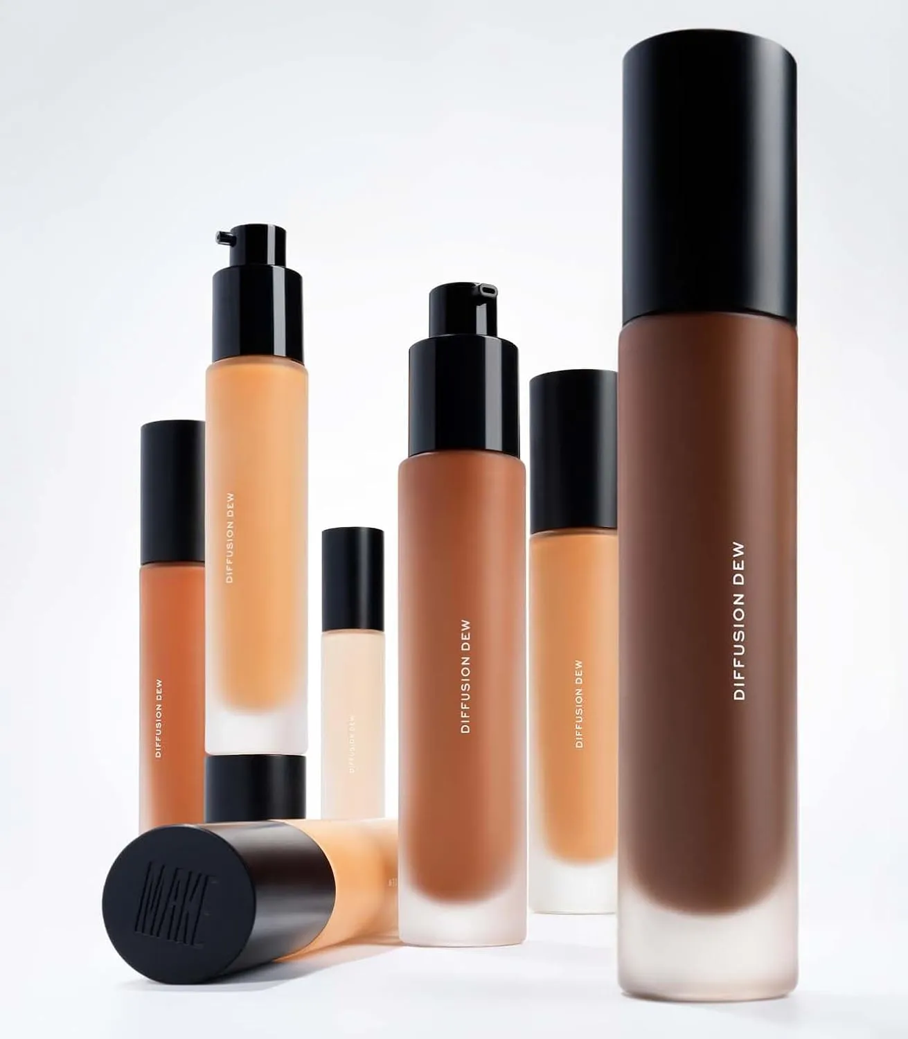 MAKE Beauty Diffusion Dew Skin Tint. Sheer to Medium Coverage Radiant Finish. Blurring, Smoothing, and Brightening for Glowing Complexion. Enhanced with Niacinamide and Adenosine. Beige 03