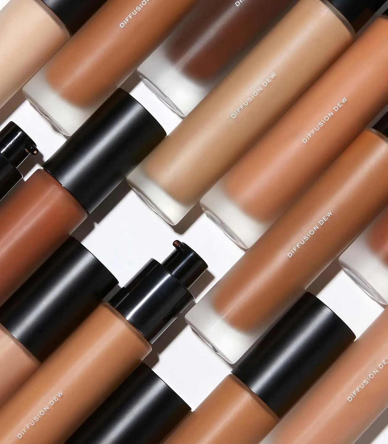 MAKE Beauty Diffusion Dew Skin Tint. Sheer to Medium Coverage Radiant Finish. Blurring, Smoothing, and Brightening for Glowing Complexion. Enhanced with Niacinamide and Adenosine. Beige 03